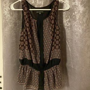 Sleeveless patterned blouse with sheer underlay